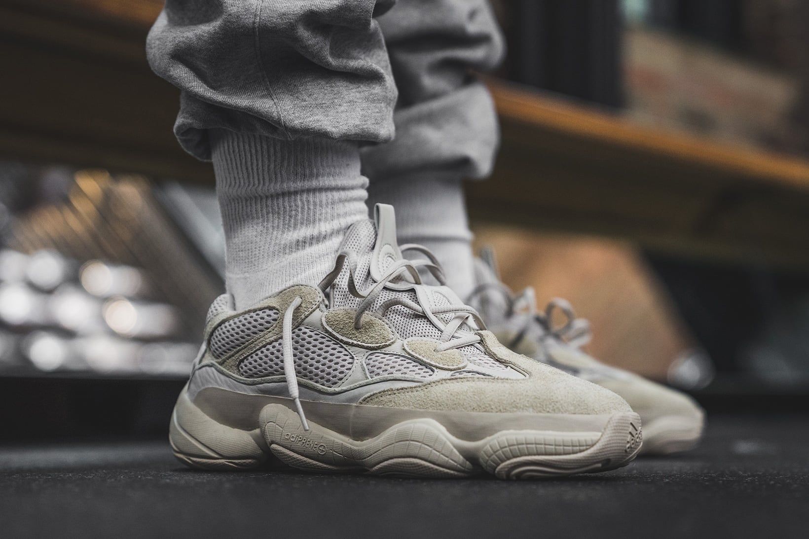 The Yeezy 500 went from nameless sample to infant sizes in under seven years. Yeezy 500 Blush on foot, grey socks and joggers, Feb 2018.