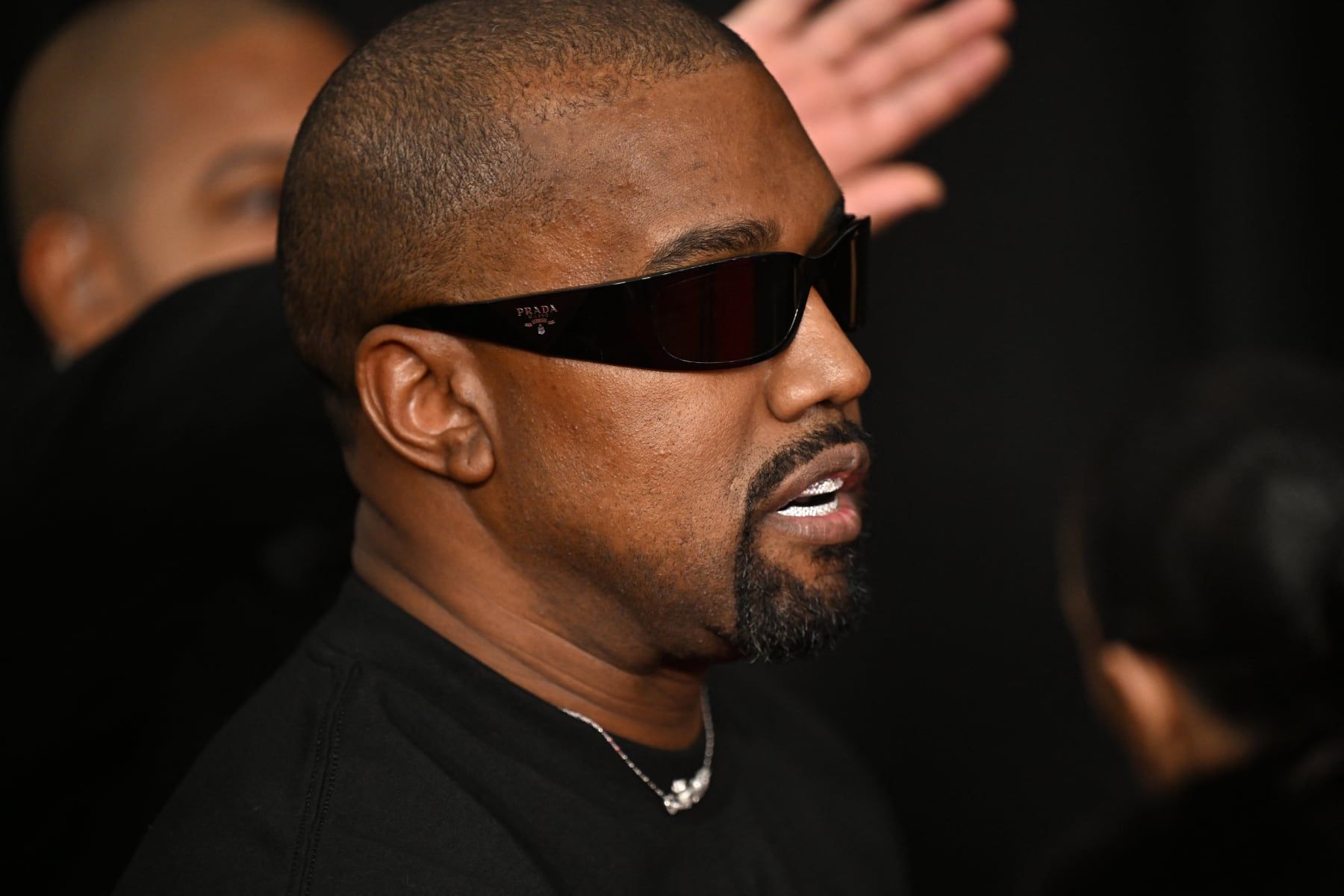 Ye’s Super Bowl ad pointed to yeezy.com. Two days later, Shopify pulled the store. Ye in dark glasses and a black tee at the Grammy Awards, Los Angeles, 2 Feb 2025.