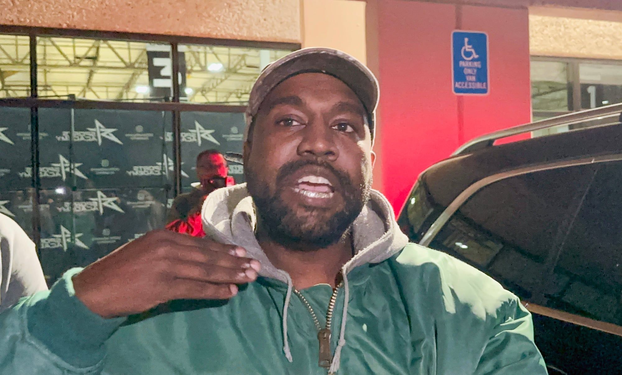 Ye’s antisemitic remarks cost him adidas, Gap and Balenciaga within 17 days. Ye in a green bomber and grey hoodie, speaking to camera, Los Angeles, 28 Oct 2022.