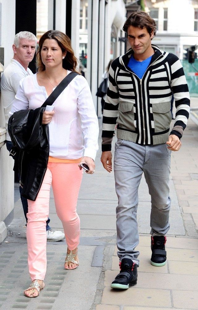 Roger Federer walked Bond Street in Air Yeezy 2s, then won Wimbledon. Roger Federer walking Bond Street next to Mirka, striped cardigan, grey joggers, Nike Air Yeezy 2 Black/Solar Red with the glow sole, London, 19 Jun 2012.