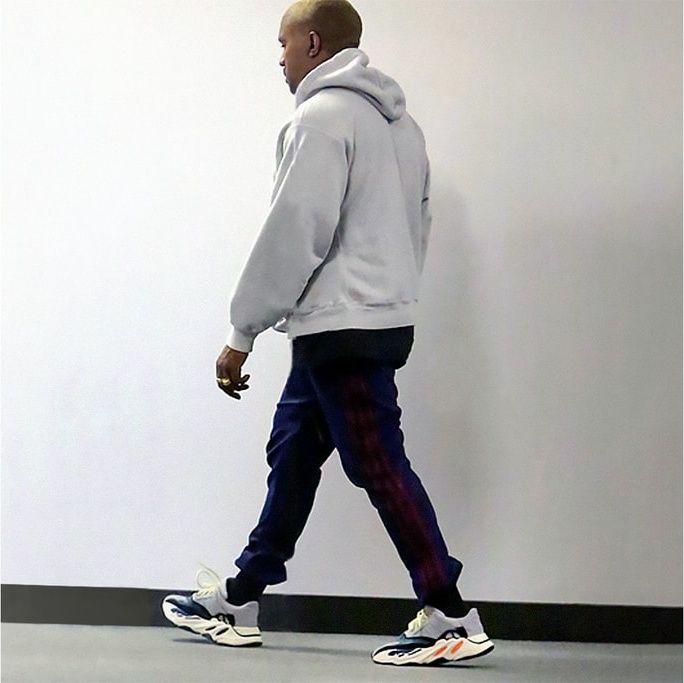 Ye’s Calabasas runner had Complex doubting it was adidas. It was the Wave Runner. Wave Runner colourway on Ye, full length, grey hoodie and navy track pants, Calabasas office, early Jan 2017.