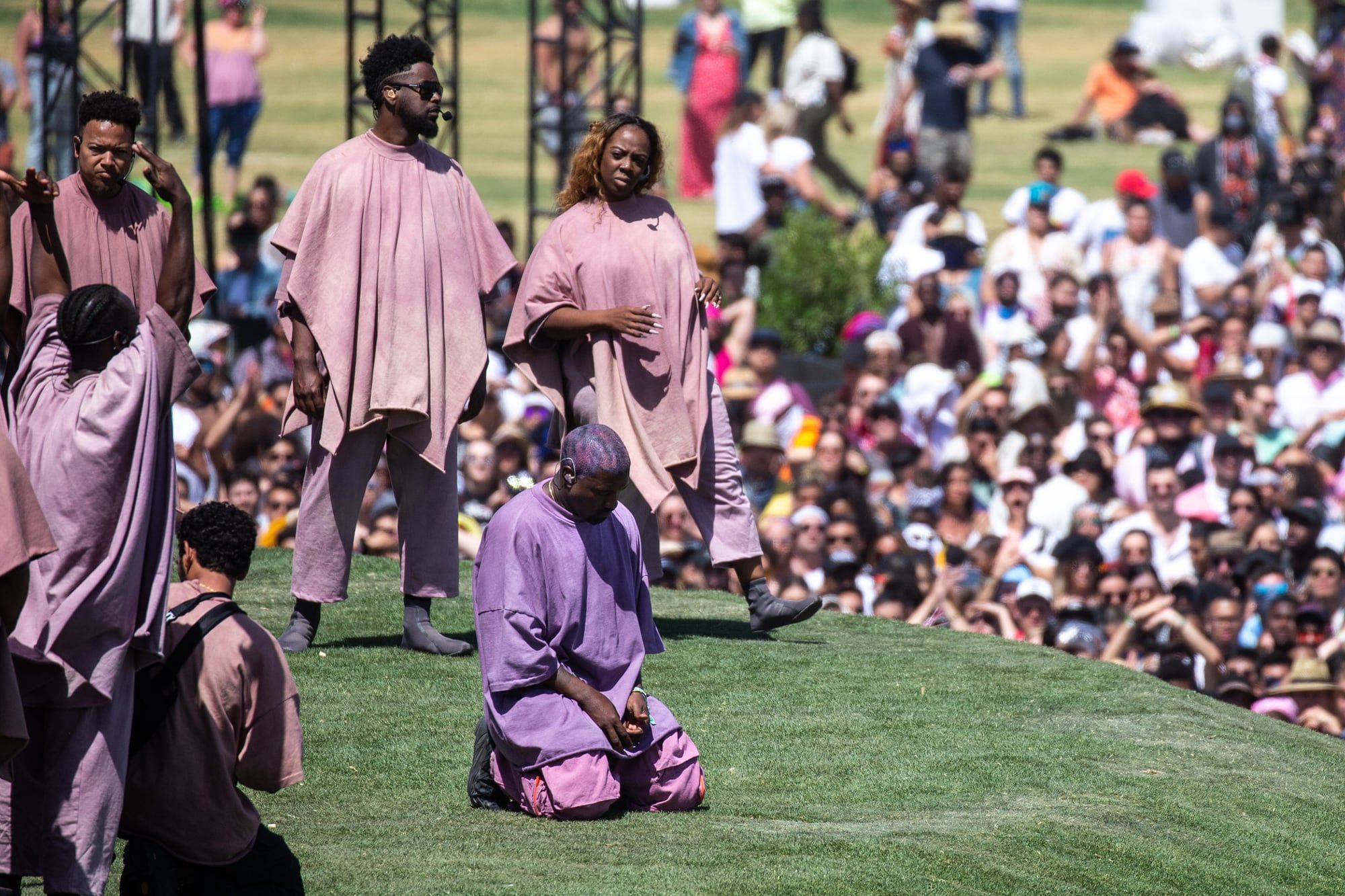 Ye’s choir wore the Scuba at Coachella. It was never sold to the public.. Ye kneeling on the Sunday Service hill at Coachella, 21 Apr 2019; the choir behind him in the grey Coachella Scuba.