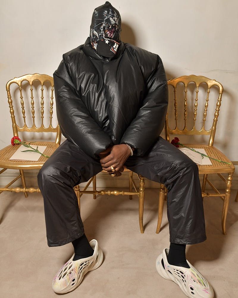 Ye wore all three Round Jacket colours before Gap put them on sale. Black, Ye seated at Balenciaga's couture show, Paris, 7 Jul 2021.