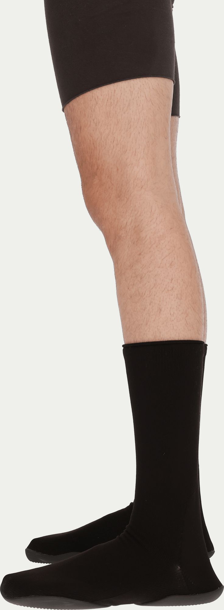 Ye’s first shoe after adidas was a $200 sock. Then it cost $20.. Black, on a model's leg, yeezy.com product image.