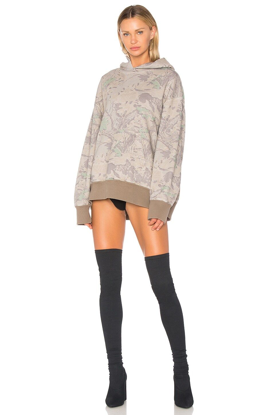 Season 4’s show was all buses and heat. Its camo hoodie went for $375. Camo, front, on a model with Season 4 stretch boots, Revolve product image.
