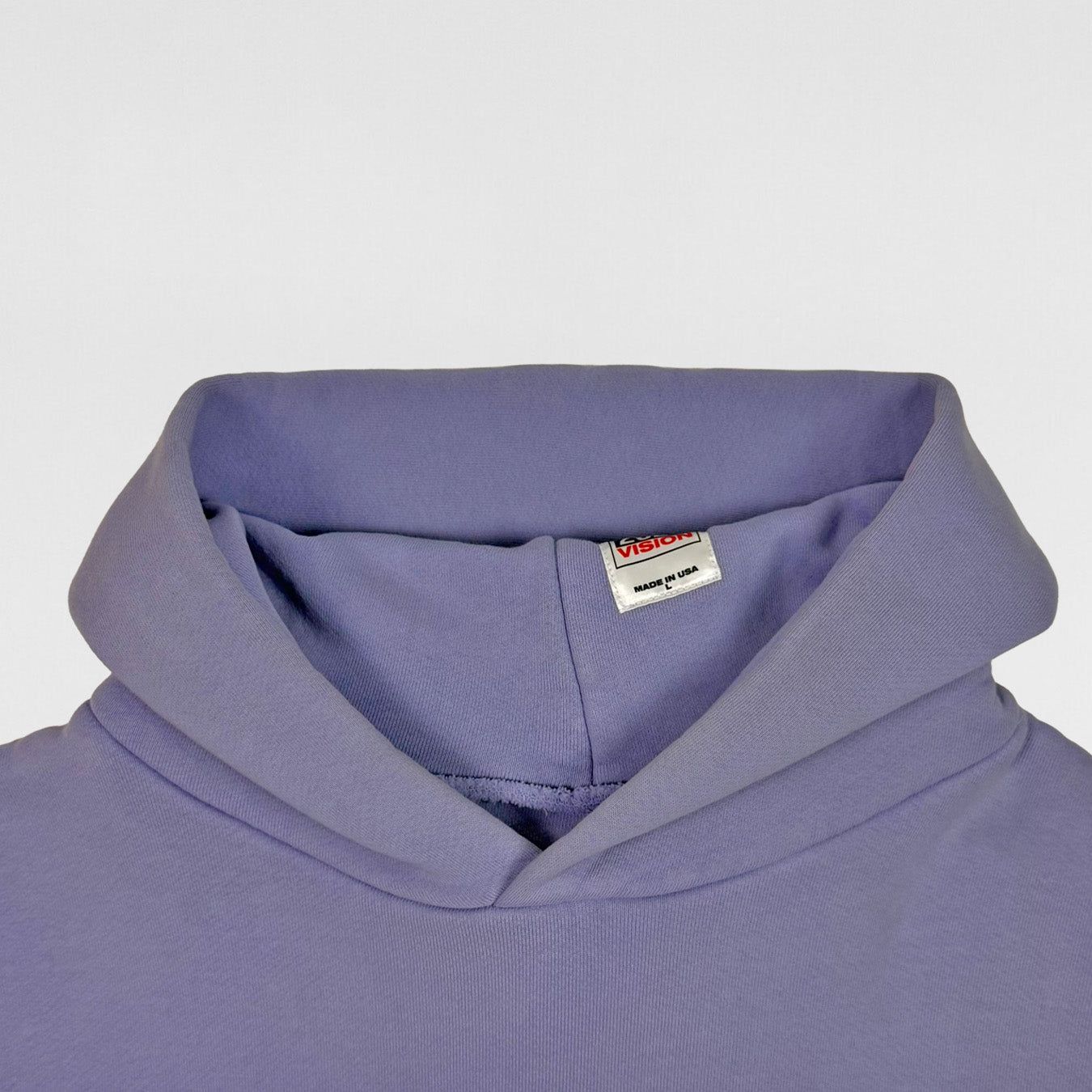 Ye ran for president in 2020, and his campaign hoodie had no slogan. The neck label: 2020 VISION, MADE IN USA.