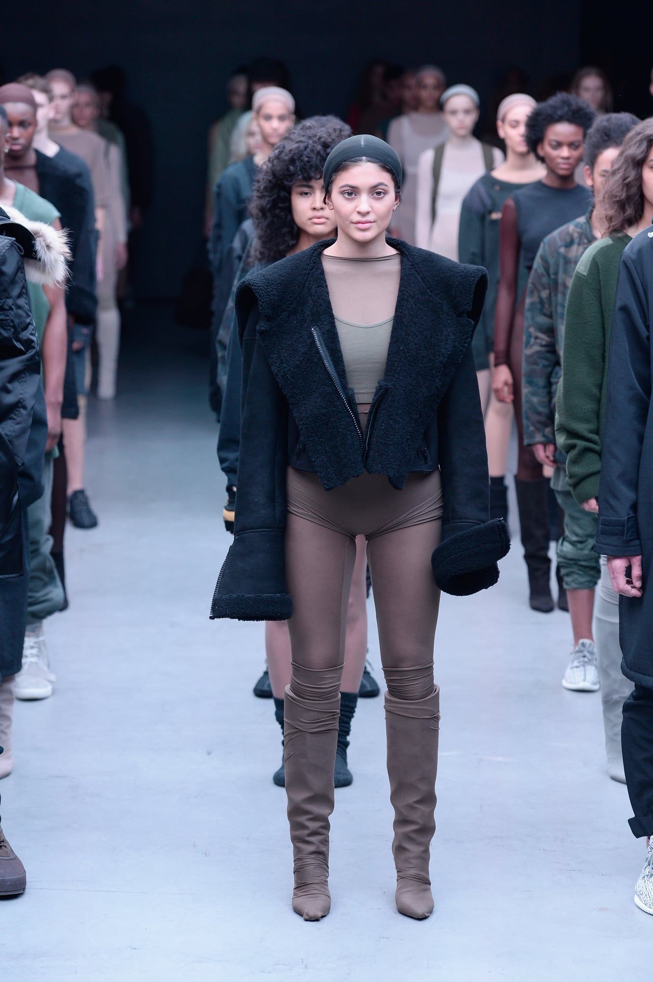 Kylie Jenner walked Yeezy Season 1. A year later, Ye lost her to Puma. Kylie Jenner in the same look in the Yeezy Season 1 line-up, with the other models around her, 12 Feb 2015.