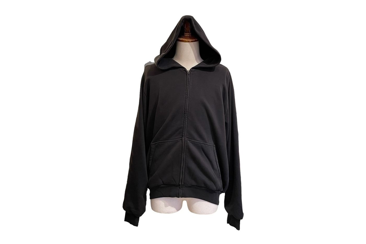 Yeezy Gap never sold a zip-up hoodie. A Harajuku vintage store did. Black zip-up on a mannequin.