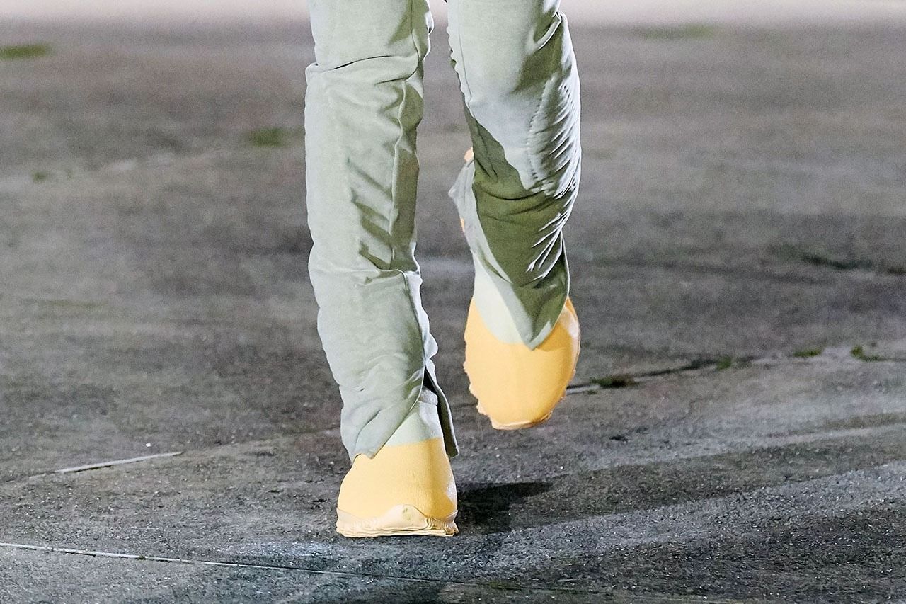 Ye wore a yellow Season 8 boot to the office 19 months before it dropped. The yellow boot on the Yeezy Season 8 runway, Paris, March 2020.
