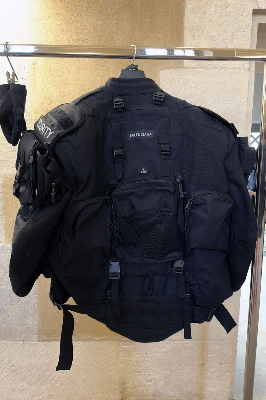 Ye opened Balenciaga’s mud show 19 days before the house cut ties with him. The look 1 jacket from the back at the re-see: padded shell, straps and pouches.