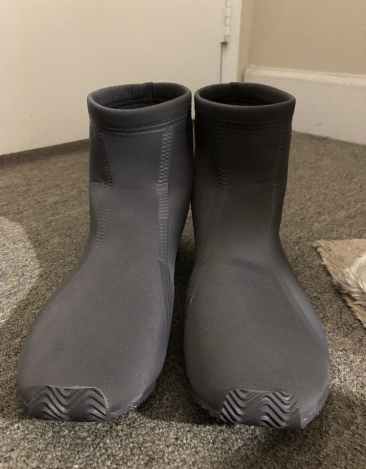 Ye’s choir wore the Scuba at Coachella. It was never sold to the public.. A pair of Coachella Scuba samples in dark grey neoprene, US 12.
