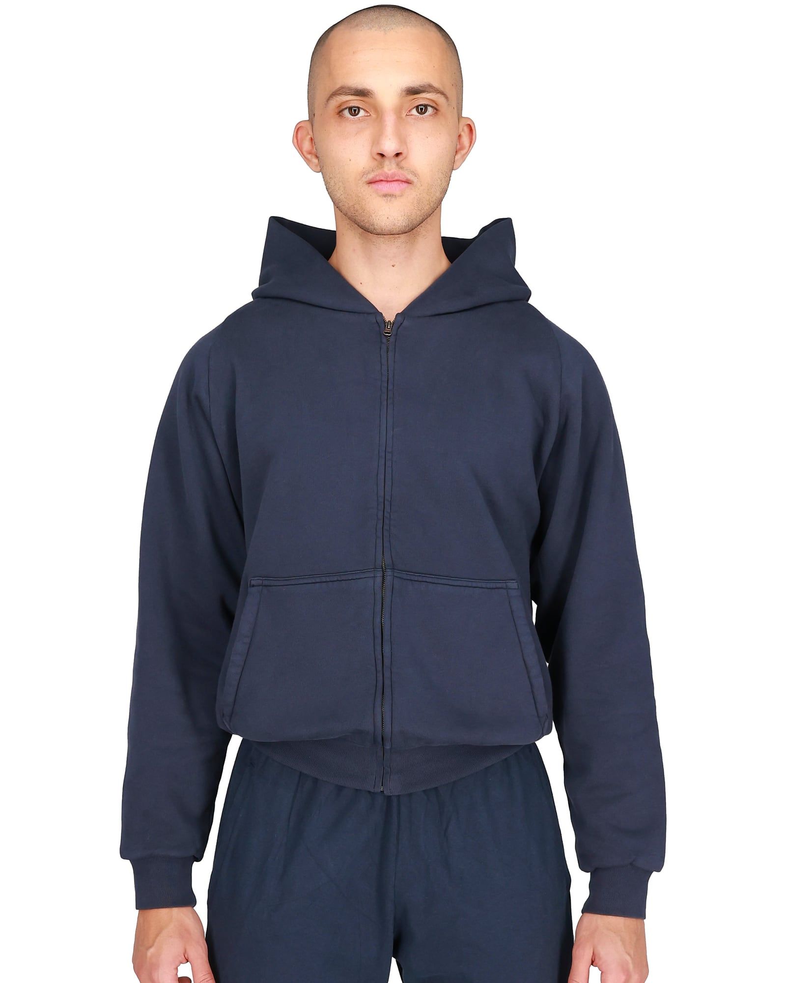 The Yeezy Gap zip-up missed Gap entirely and sold out on yeezy.com. Navy, front, on a model, yeezy.com listing shot.