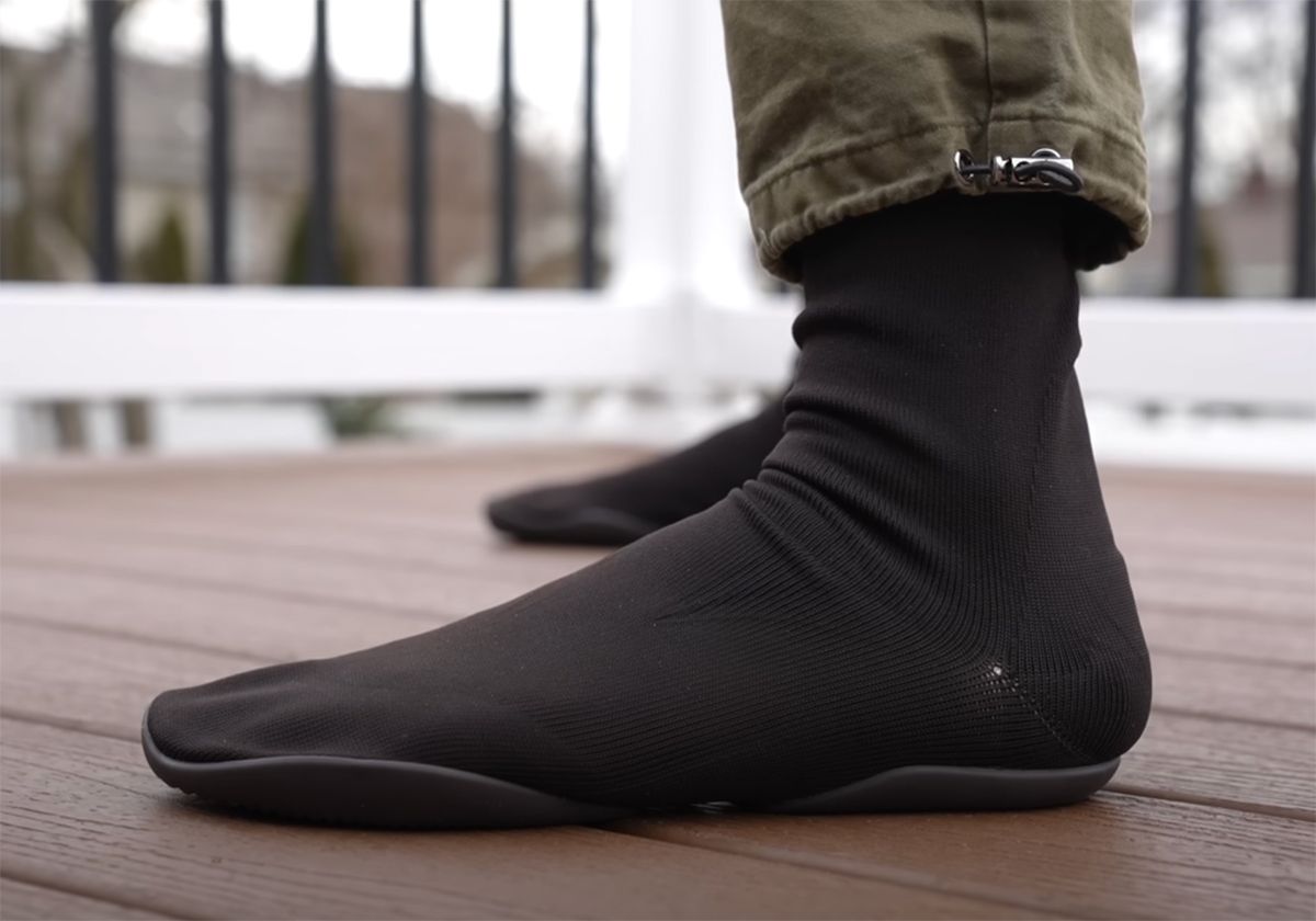 Ye’s first shoe after adidas was a $200 sock. Then it cost $20.. Black, on foot.