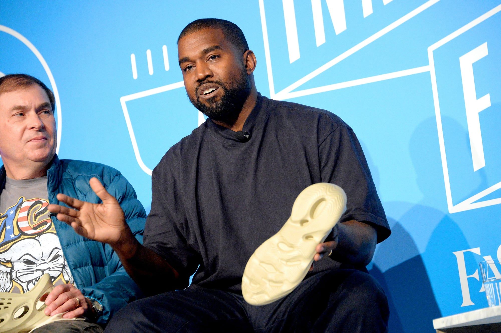 Ye took Foam Runners to Astroworld seven months before they dropped. Ye and Steven Smith at the Fast Company Innovation Festival, Nov 2019, holding Foam Runners.