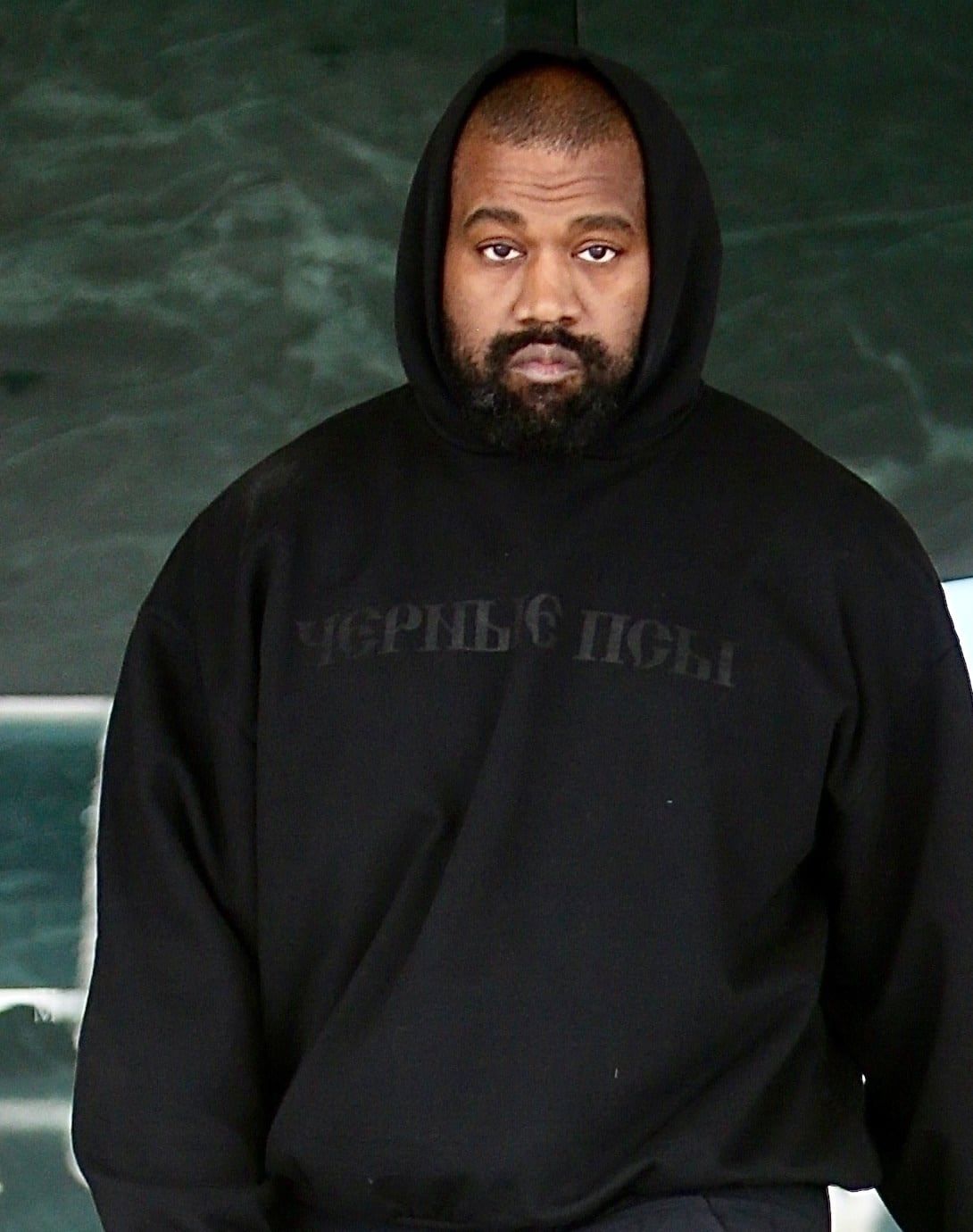 The Black Dogs hoodie went on sale at 1:24pm. Ye wore it that night. Black, Ye on 18 Mar 2024, cropped to Ye.