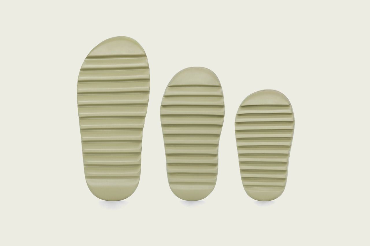 The Yeezy Slide was one piece of foam, and it out-ranked Prada. Resin, the grooved outsoles in adult, kids and infant sizes, adidas launch image.