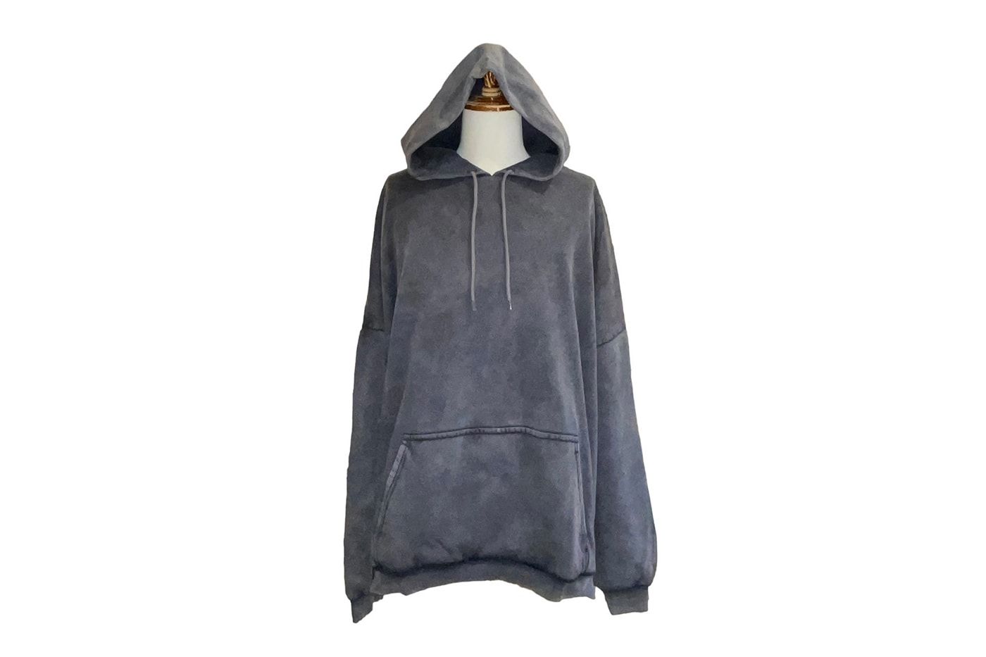 Yeezy Gap never sold a zip-up hoodie. A Harajuku vintage store did. Grey pullover hoodie with drawstrings, sun-faded.