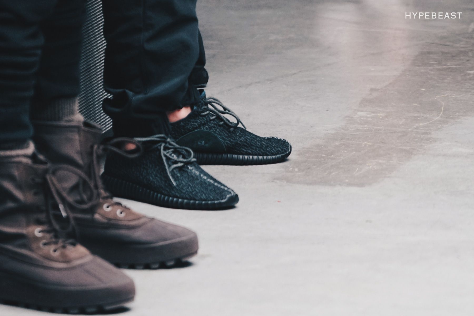 Yeezy Season 1 had Beyoncé front row. Ye bowed in a plain hoodie.. Black Yeezy Boost 350 and brown duck boots on models' feet at Yeezy Season 1, 12 Feb 2015.