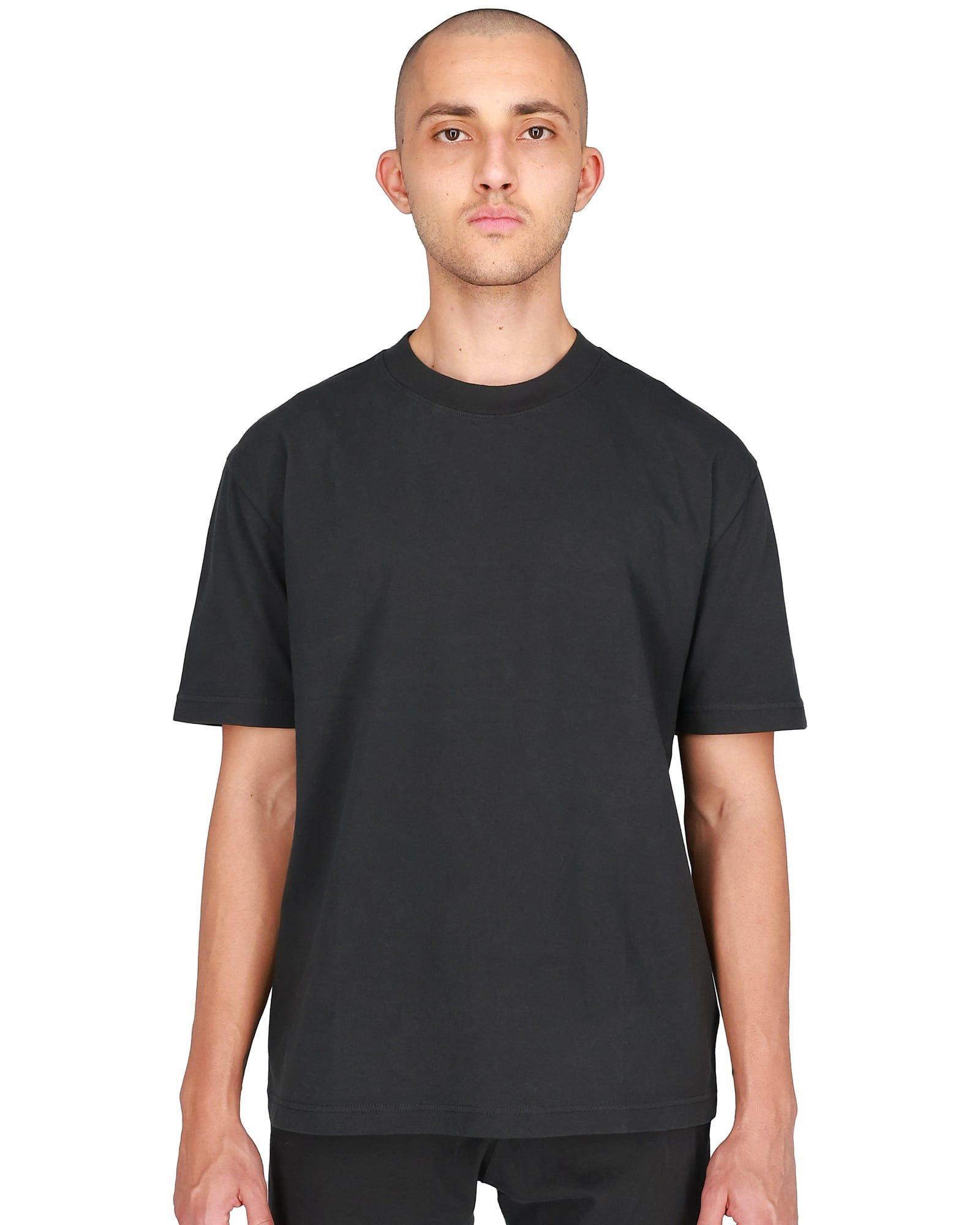 Ye’s store sold a plain tee in 2024. Its SKU started with YZYGAP. Black, front, on a model, yeezy.com listing shot.