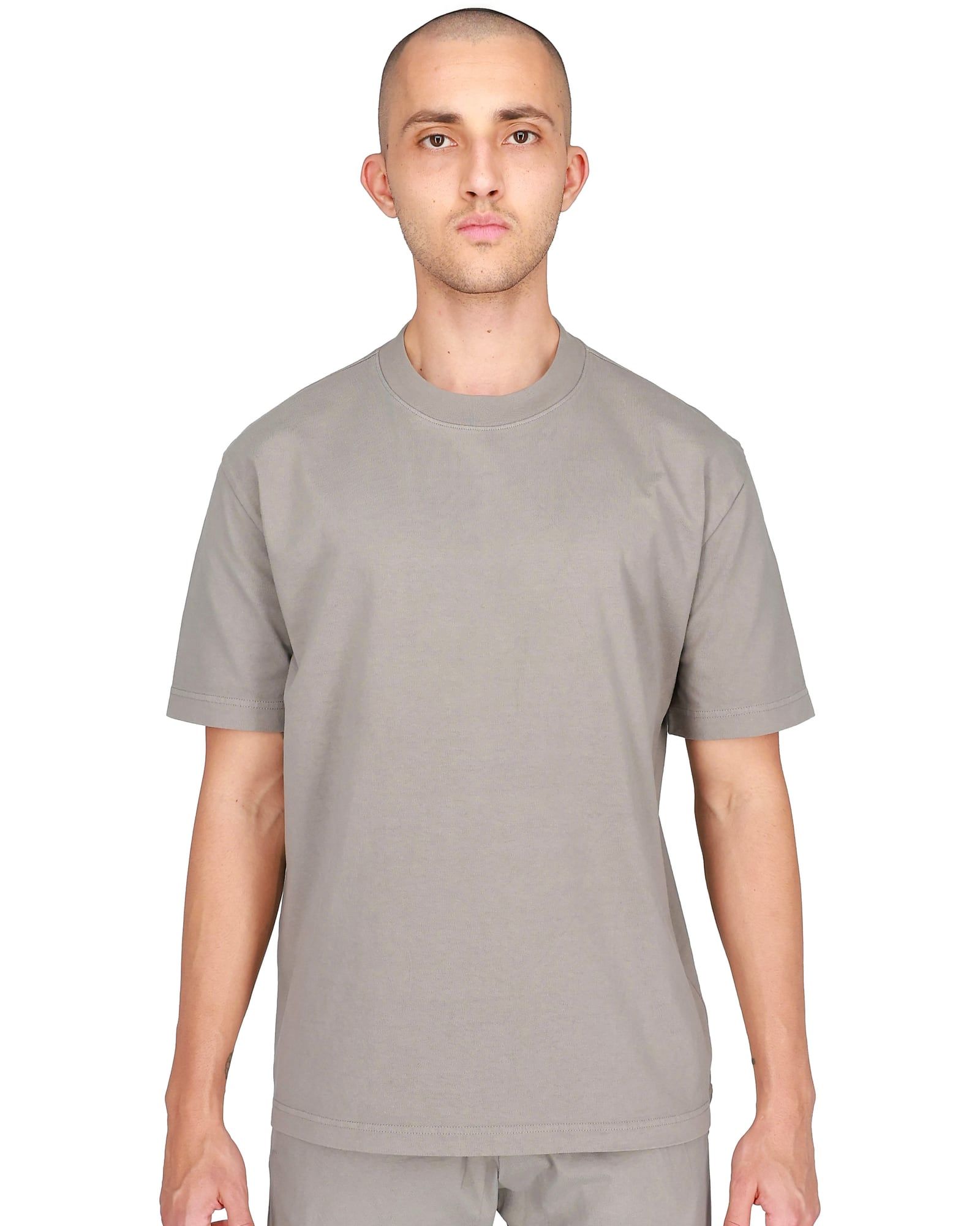 Ye’s store sold a plain tee in 2024. Its SKU started with YZYGAP. Taupe, front, on a model, yeezy.com listing shot.